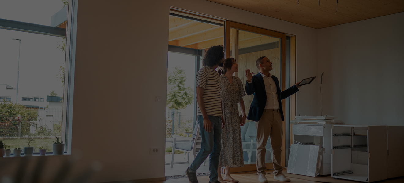 Realtor showing couple a new home.
