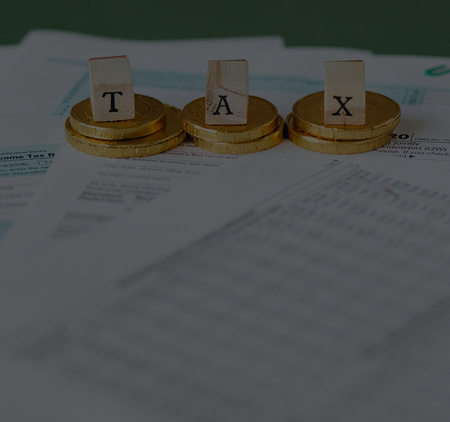 Coins and tax letters on documents.