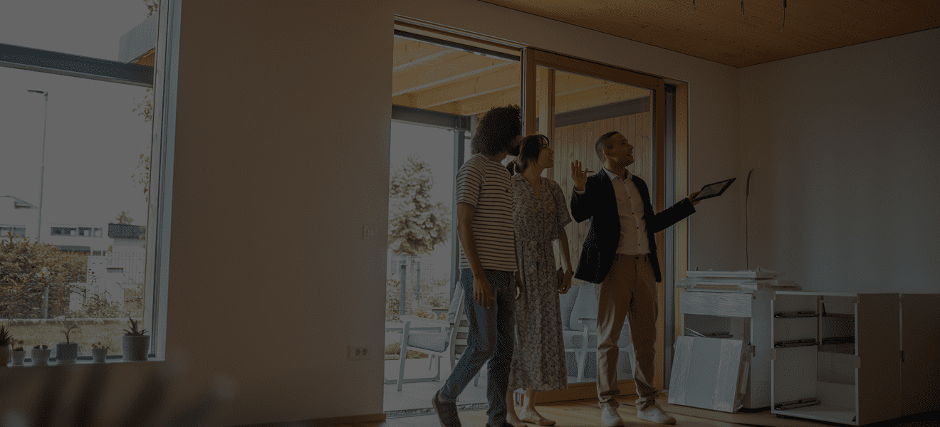 Realtor showing couple a new home.
