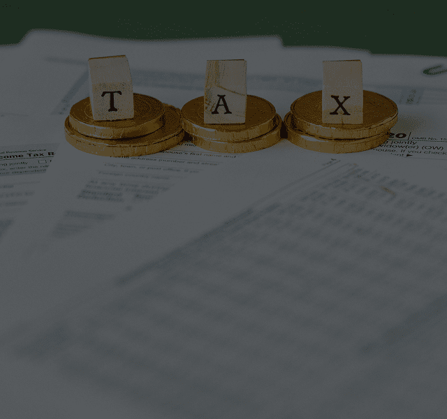 Coins and tax letters on documents.